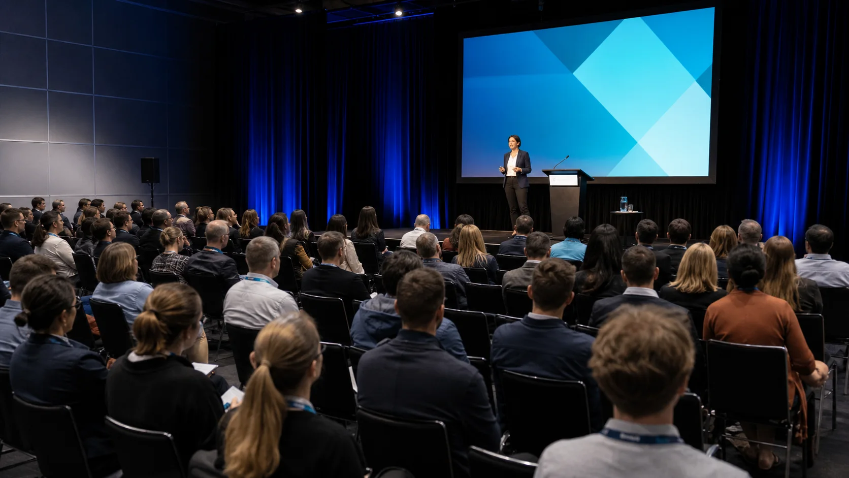 SmallBiz Expo stage session with a seated business audience