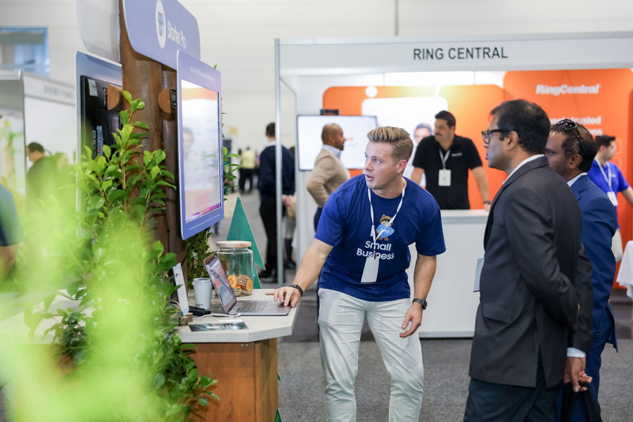 SmallBiz Melbourne exhibitor demonstrating booth technology to business attendees